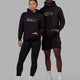 Duo wearing Unisex Strength FLXFLeece Hoodie - Black-Black