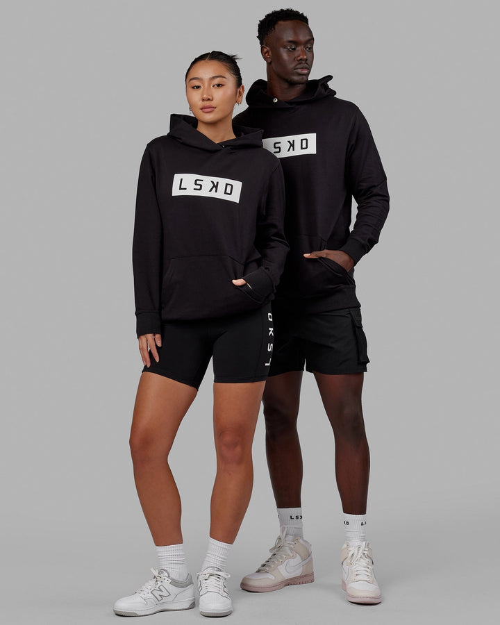 Duo wearing Unisex Strength FLXFLeece Hoodie - Black-White