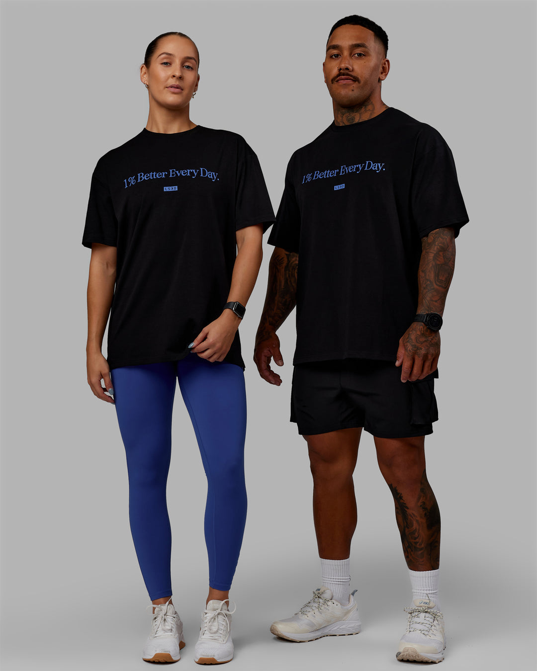 Duo wearing Unisex 1% Better FLXCotton Tee Oversize - Black-Power Cobalt