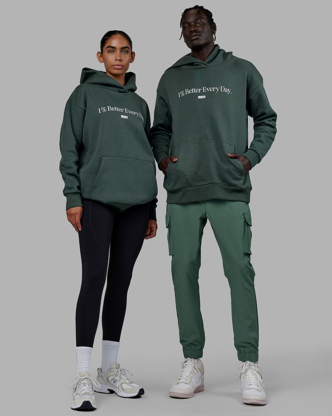 Duo wearing Unisex 1% Better Hoodie Oversize - Vital Green
