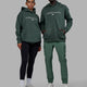 Duo wearing Unisex 1% Better Hoodie Oversize - Vital Green