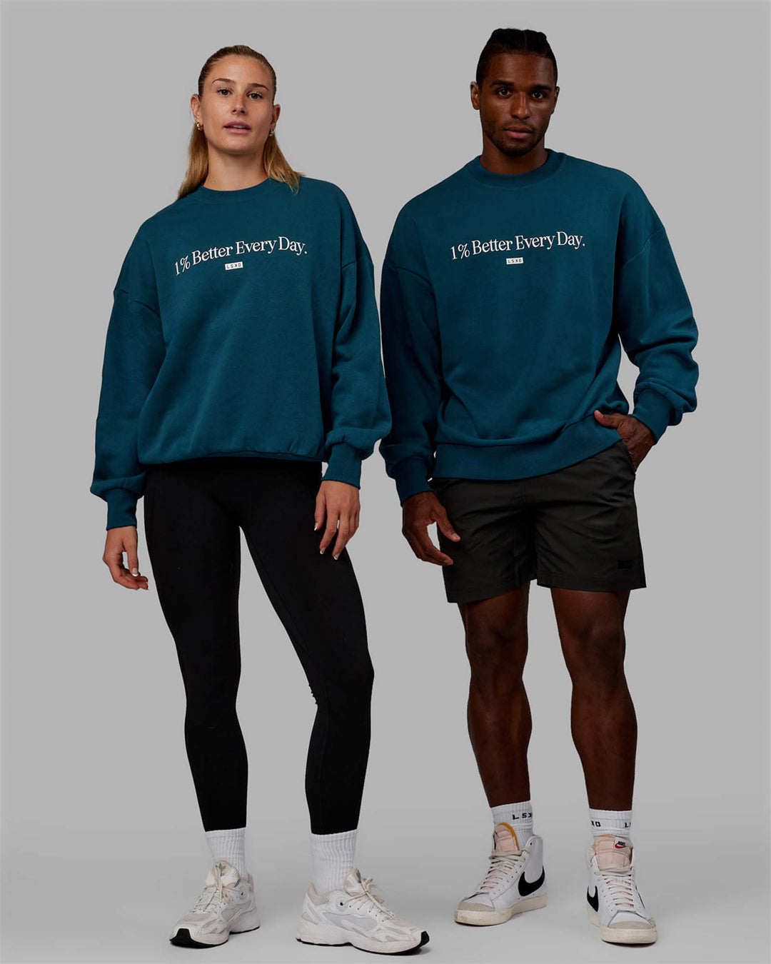 Duo wearing Unisex 1% Better Sweater Oversize - Deep Lagoon-White