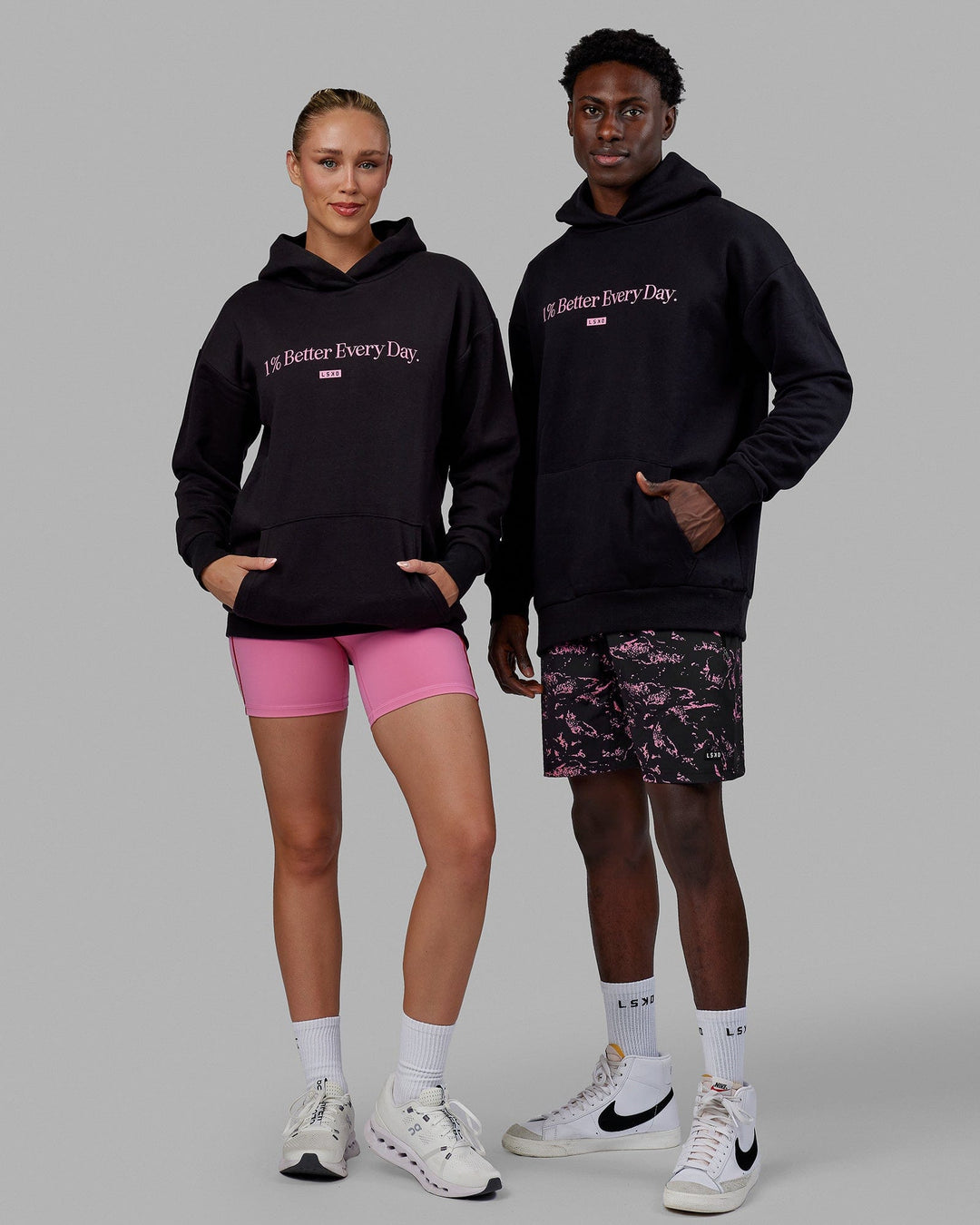 Duo wearing Unisex 1% Better Hoodie Oversize - Black-Pink Rose