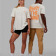 Duo wearing Unisex E.T.J FLXCotton Tee Oversize - Off White-Tangerine
