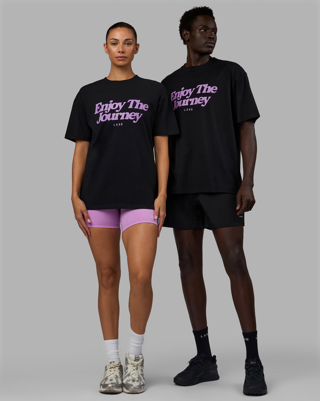 Duo wearing Unisex Enjoy The Journey FLXCotton Tee Oversize - Black-Light Violet