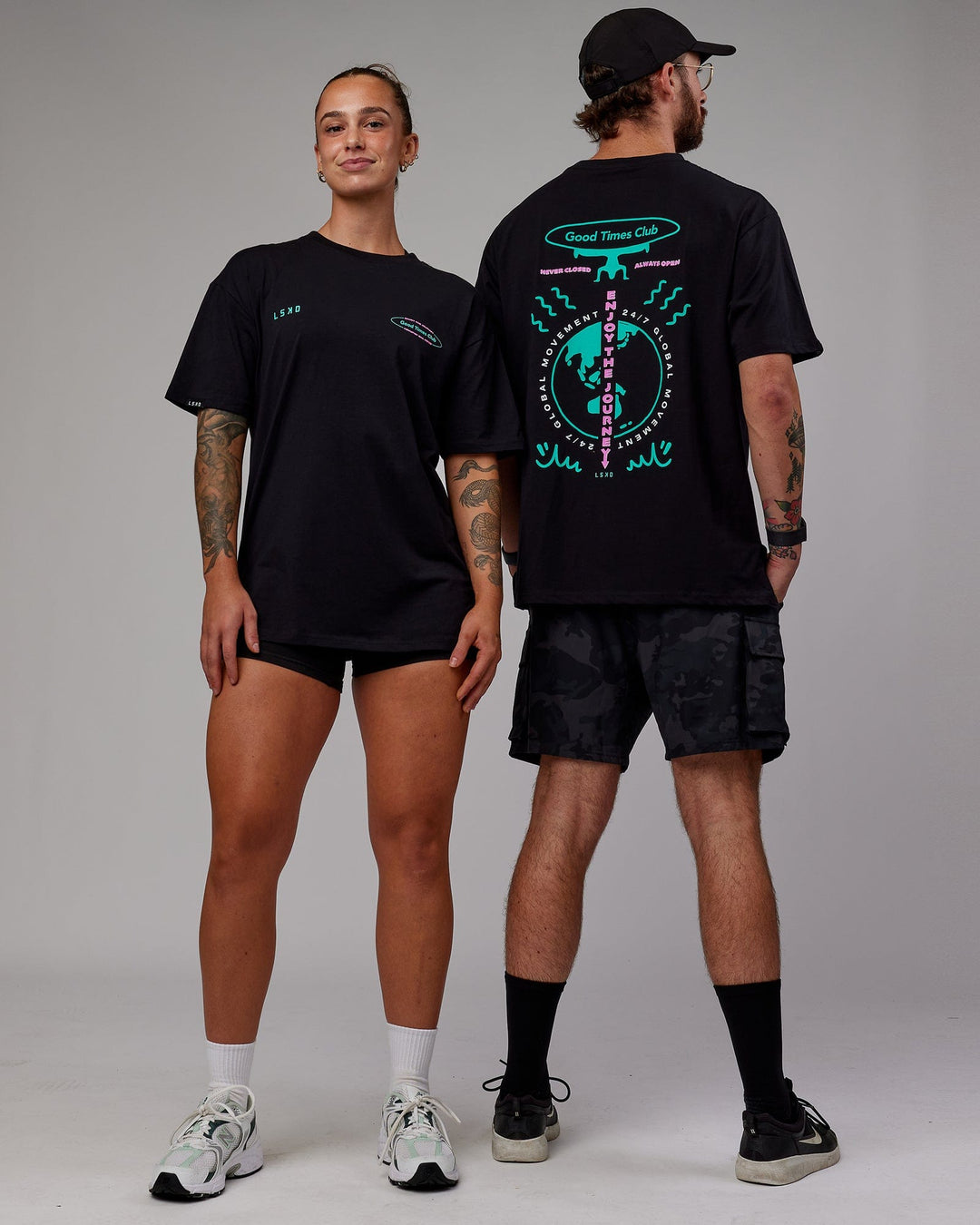 Duo wearing Unisex Global Movement FLXCotton Oversize Tee - Black-Multi