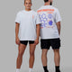 Duo wearing Unisex Good Times Global Heavyweight Tee Oversize - White-Red-Purple