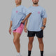 Duo wearing Unisex Good Times Heavyweight Tee Oversize - Windsurfer-Spark Pink