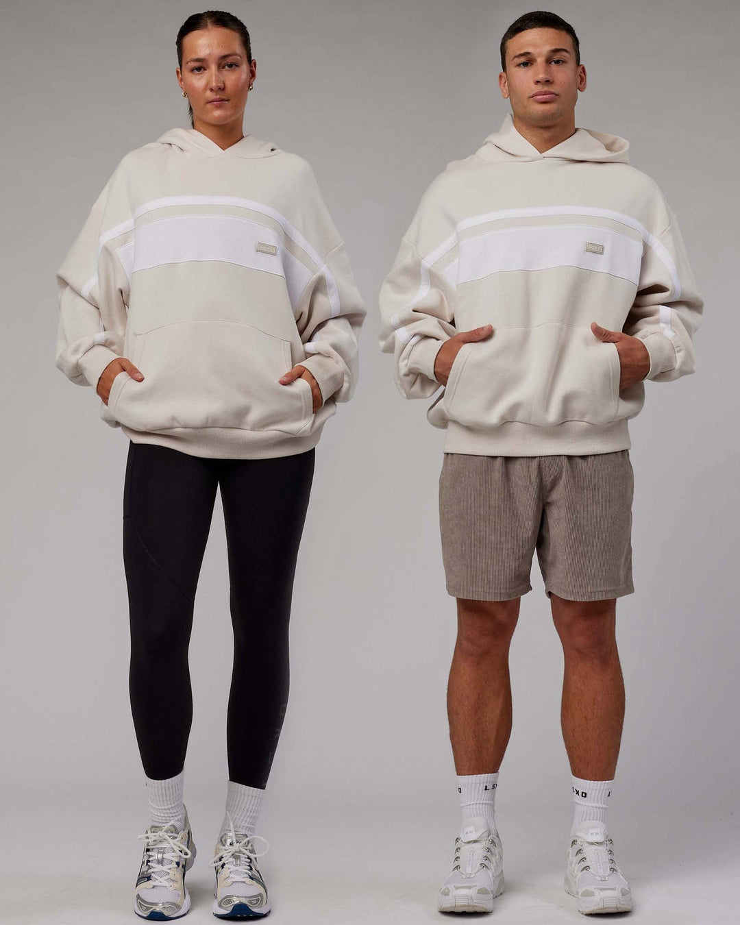 Duo wearing Unisex Intercept Hoodie Oversize - Clay-White