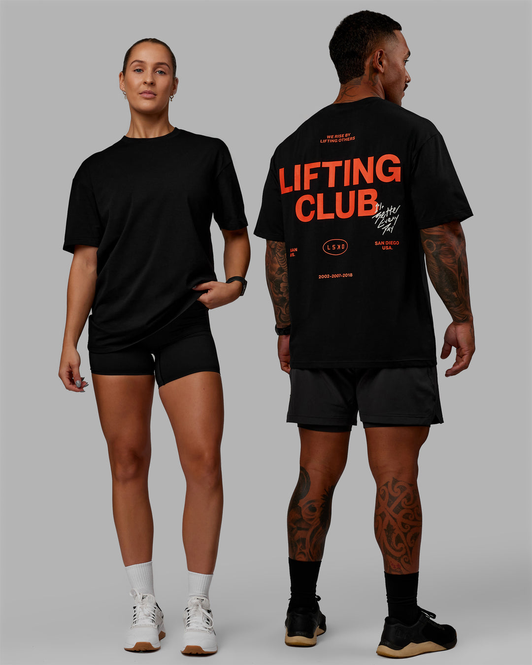 Duo wearing Unisex Lifting Club FLXCotton Tee Oversize - Black-Red