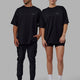 Duo wearing Unisex PimaFLX Tee Oversize - Black