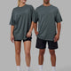 Duo wearing Unisex PimaFLX Tee Oversize - Storm