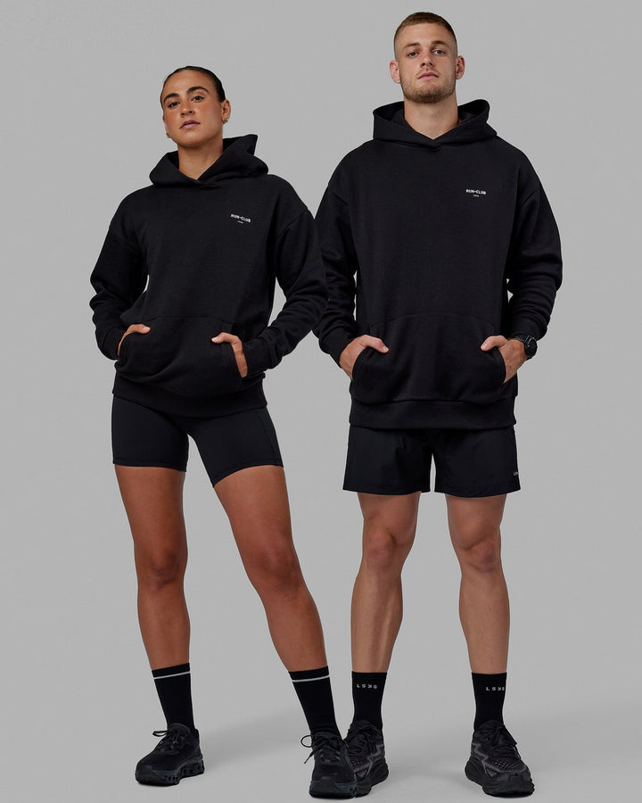 Duo wearing Unisex RUN-CLUB Hoodie Oversize - Black
