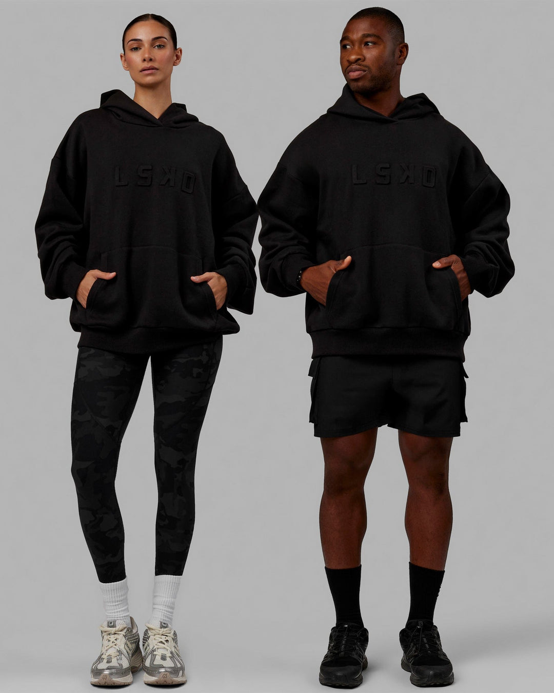 Duo wearing Unisex Stamped Hoodie Oversize - Black