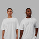 Duo wearing Unisex Stamped 2.0 Heavyweight Tee Oversize - White