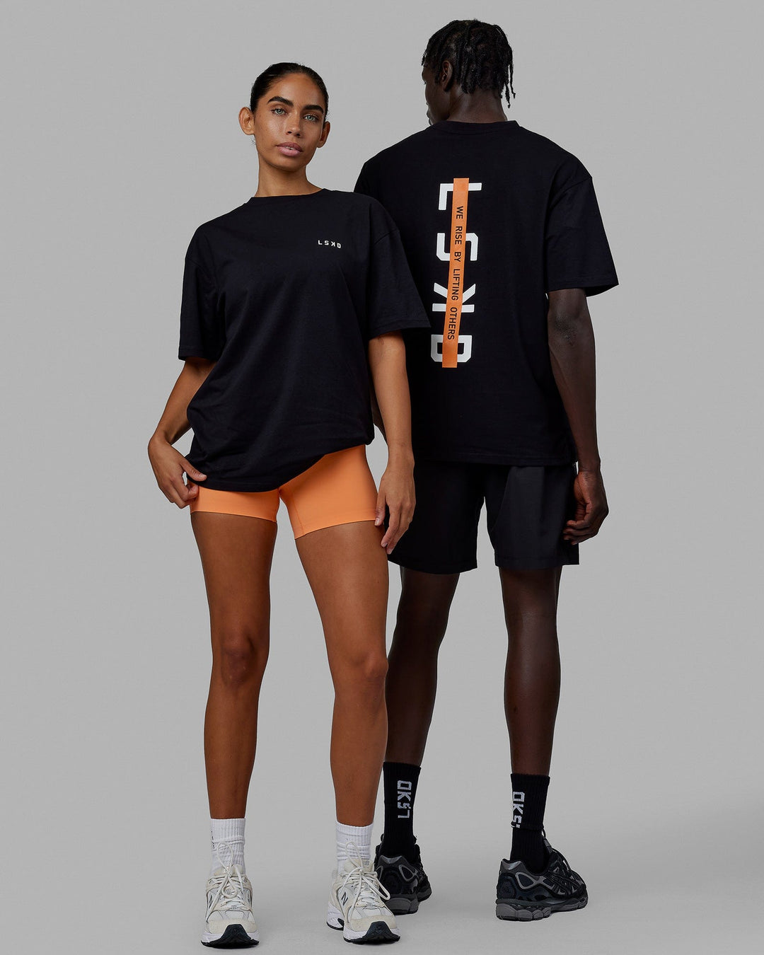 Duo wearing Unisex Strike Through FLXCotton Tee Oversize - Black-White