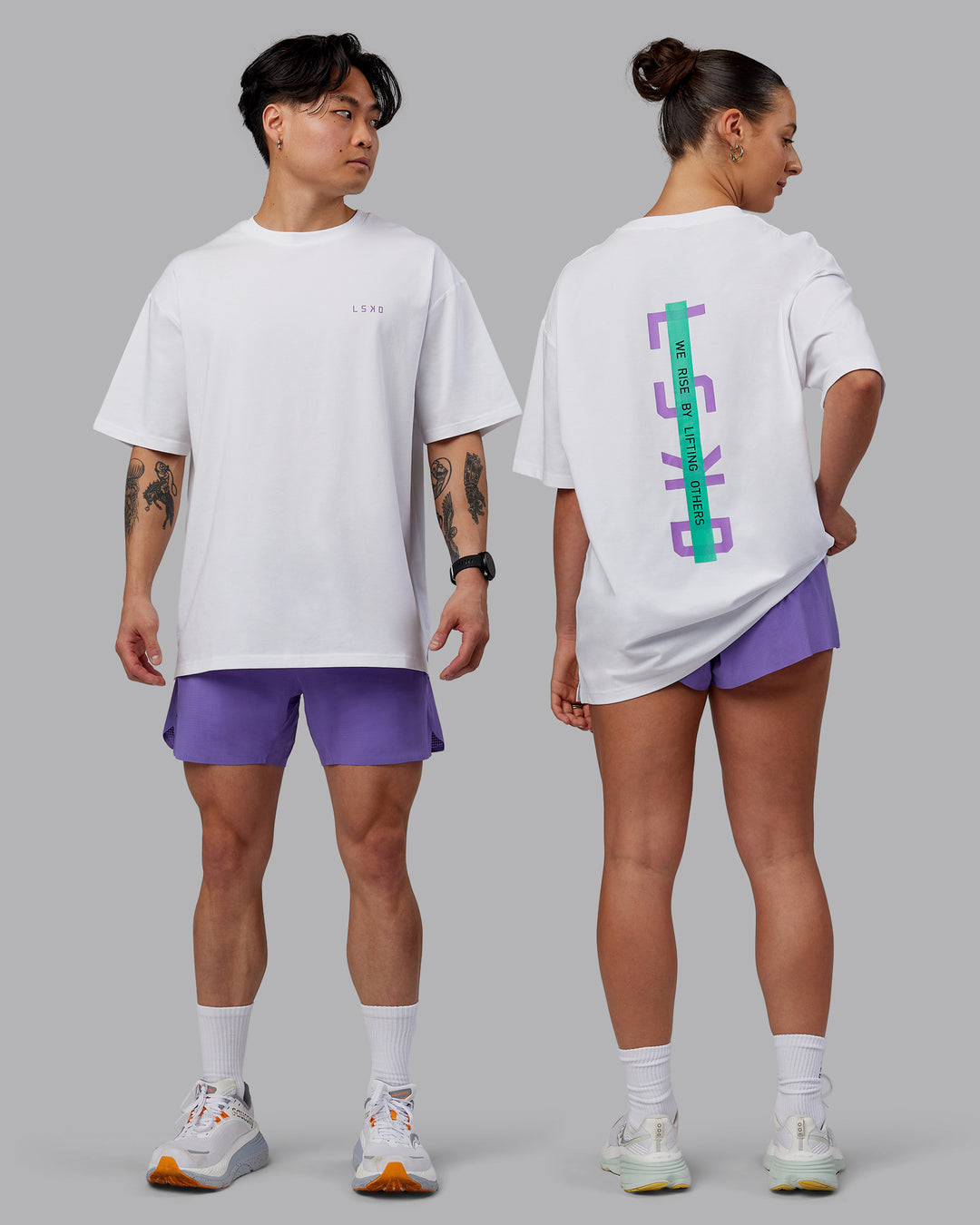 Duo wearing Unisex Strike Through FLXCotton Tee Oversize - White-Purple Swirl