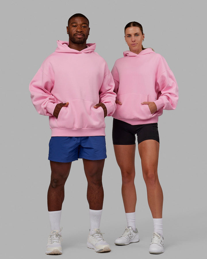 Duo wearing wearing Unisex Urban Hoodie Oversize - Pink Frosting-Galactic Blue