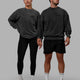 Duo wearing Unisex Washed Segmented Oversized Sweater - Black