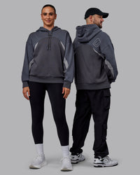 Duo wearing Unisex Y2K Concept Panel Hoodie - Asphalt-Turbulance | Thumbnail Index: 0