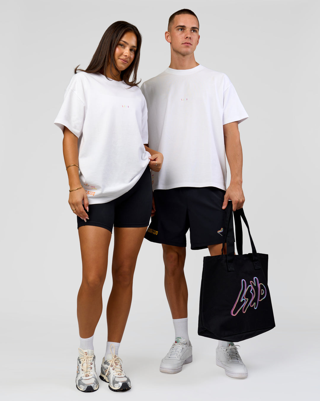 Duo wearing Pride Sticker Boxy Tee - White | Model:Bianca | Size:XS | Model:Albert | Size:M