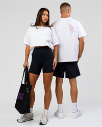 Duo wearing Pride Sticker Boxy Tee - White | Model:Bianca | Size:XS | Model:Albert | Size:M