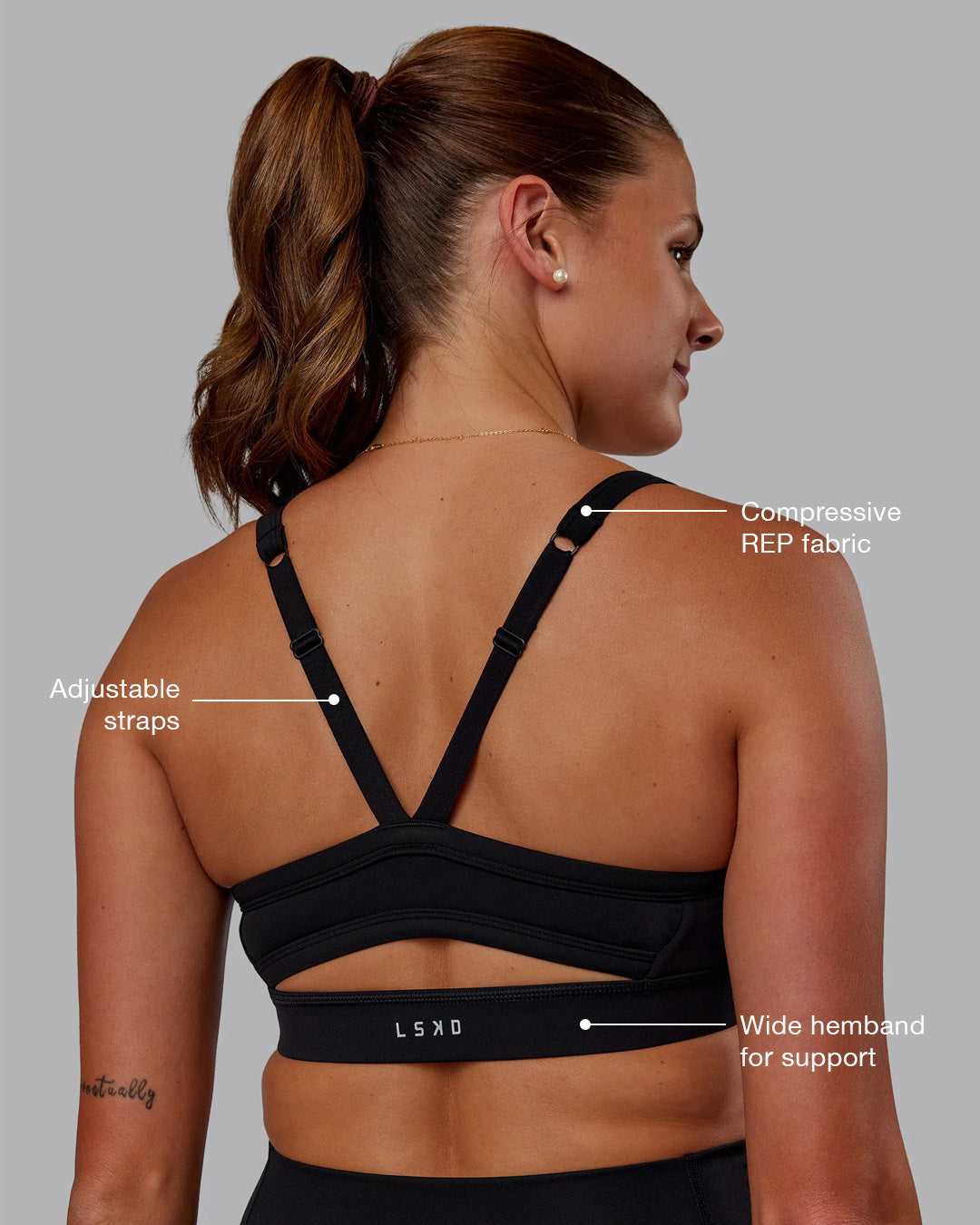 Woman wearing Momentum Sports Bra - Black | Model:Phoebe | Size:S