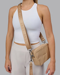 Woman wearing Go-To Shoulder Bag - Oat Milk