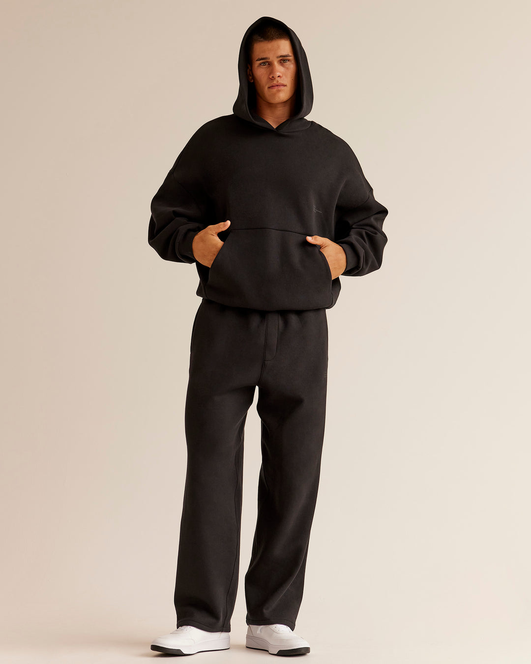 Man wearing AfterDark ZeroCrease Straight Leg Pant - Black | Model:Jackson | Size:L