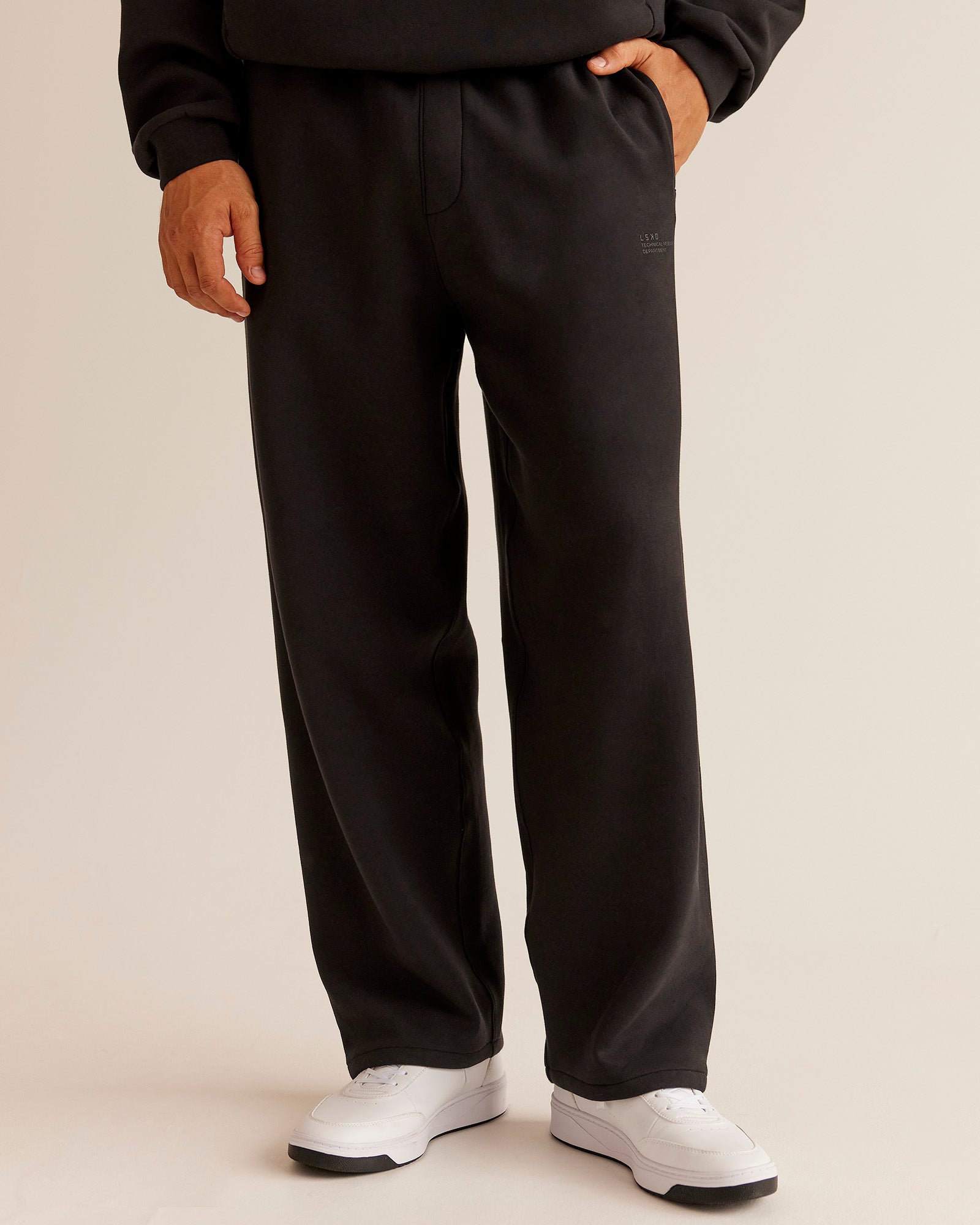 Man wearing AfterDark ZeroCrease Straight Leg Pant - Black | Model:Jackson | Size:L