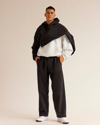 Man wearing AfterDark ZeroCrease Straight Leg Pant - Black | Model:Jackson | Size:L