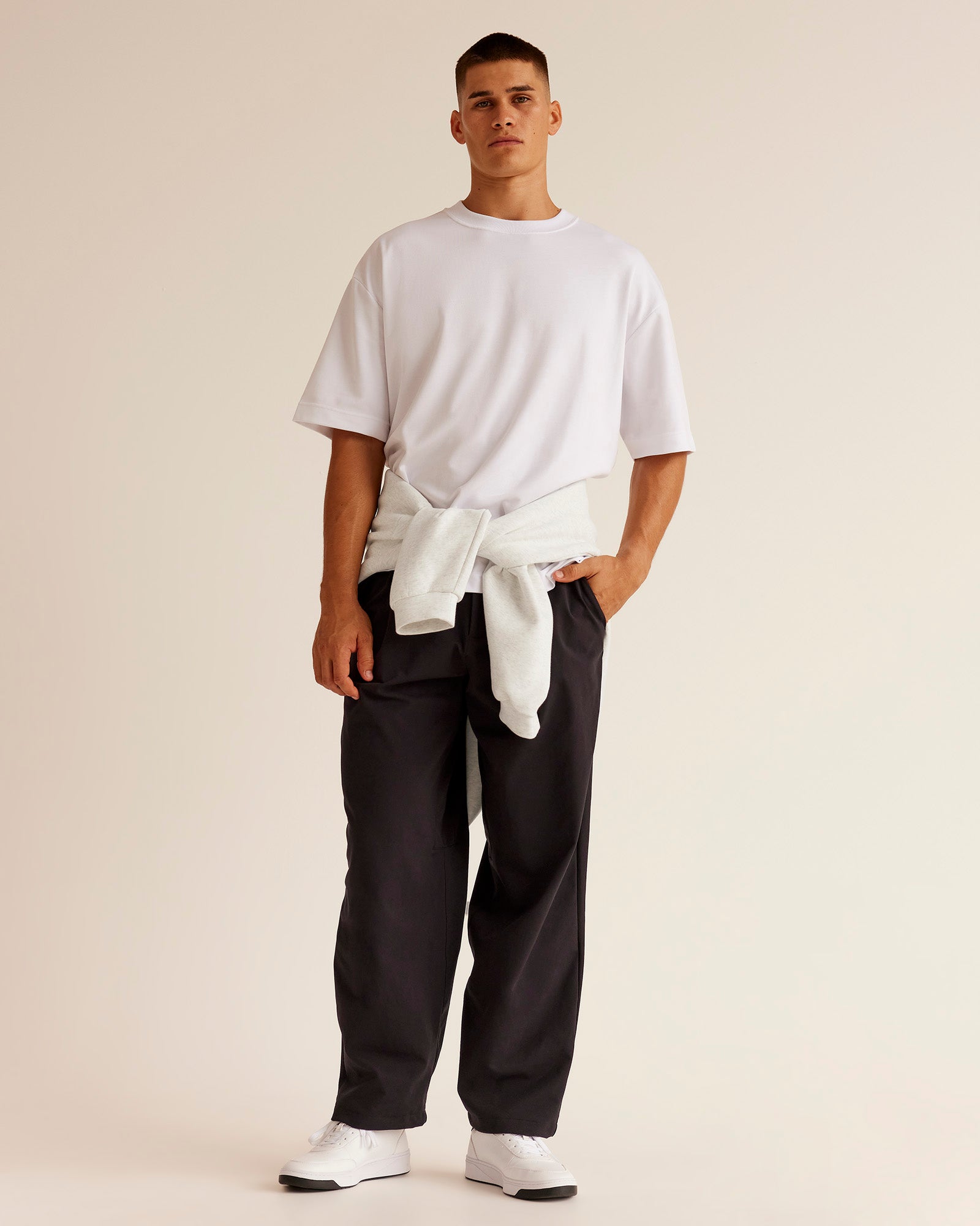 Man wearing All Day ZeroCrease™ Wide Leg Pant - Black | Model:Jackson | Size:34