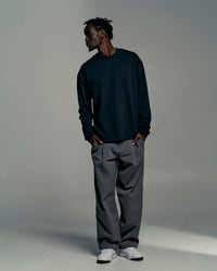 Man wearing All Day ZeroCrease™ Wide Leg Pant - Dark Storm | Model:Okello | Size:L