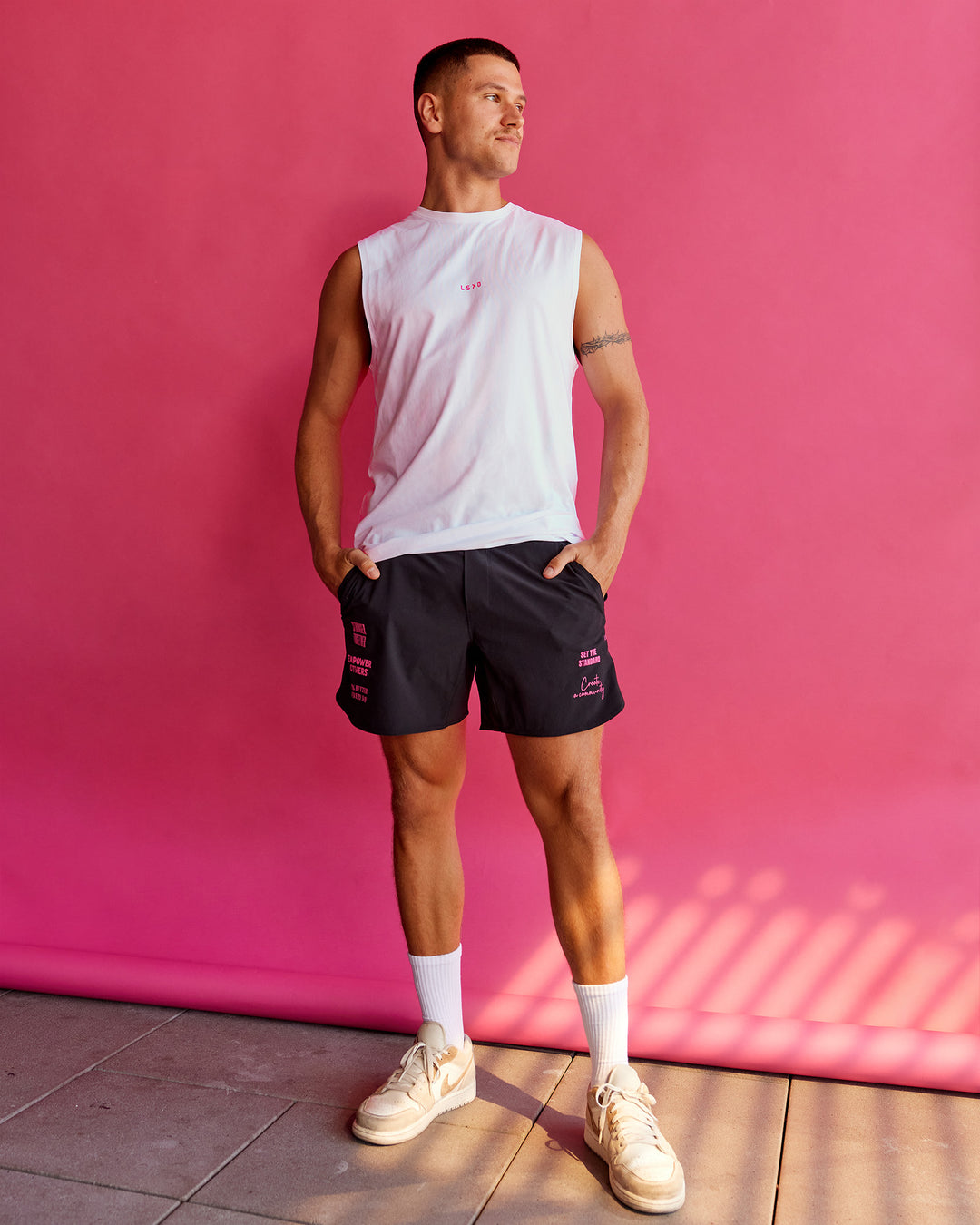 Man wearing BCAM FLXCotton Muscle Tank - White-Ultra Pink | Model:Nikola | Size:L