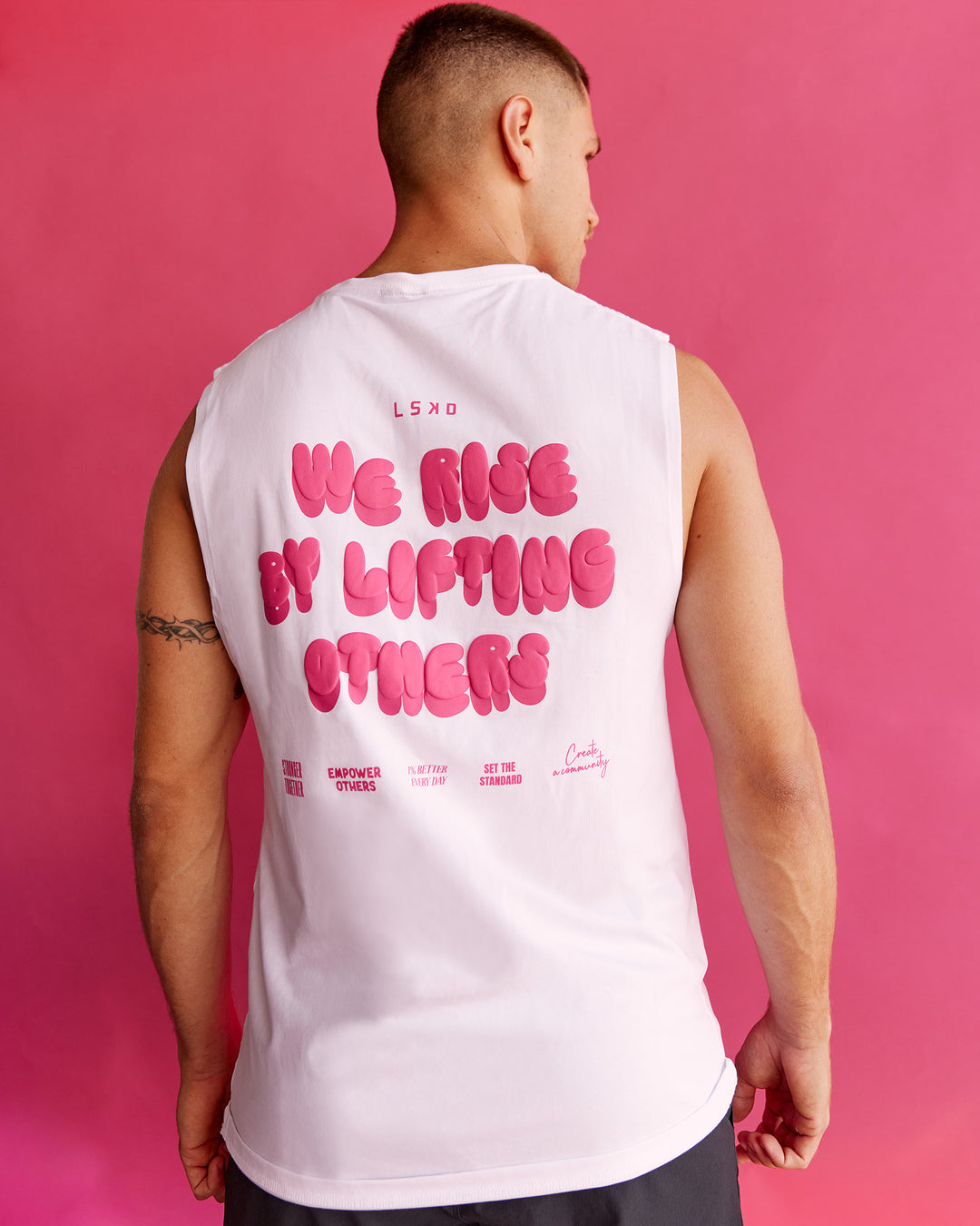 Man wearing BCAM FLXCotton Muscle Tank - White-Ultra Pink | Model:Nikola | Size:L