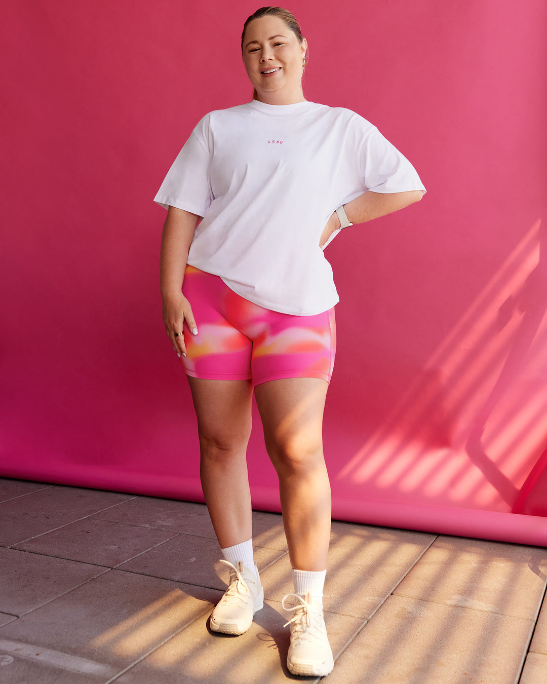 Woman wearing BCAM Go-To FLXCotton Oversized Tee - White-Ultra Pink | Size:L