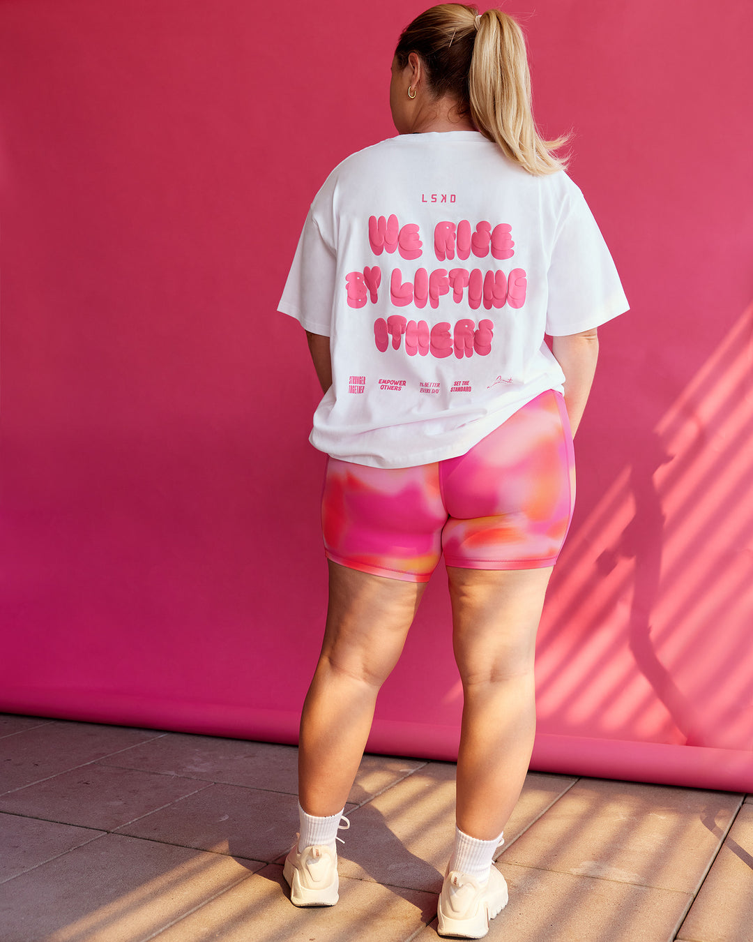 Woman wearing BCAM Go-To FLXCotton Oversized Tee - White-Ultra Pink | Size:L