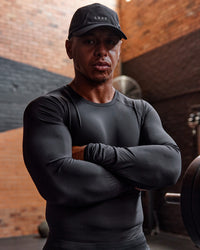 Man wearing BaseTech Long Sleeve Tee - Black | Model:Paris | Size:L
