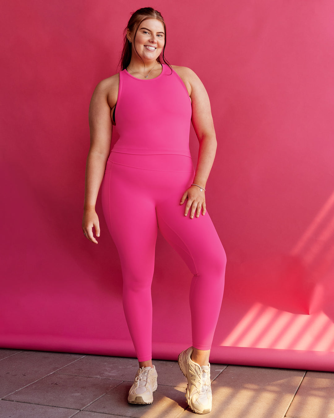 Woman wearing Flow Performance Tank 2.0 - Ultra Pink | Size:L