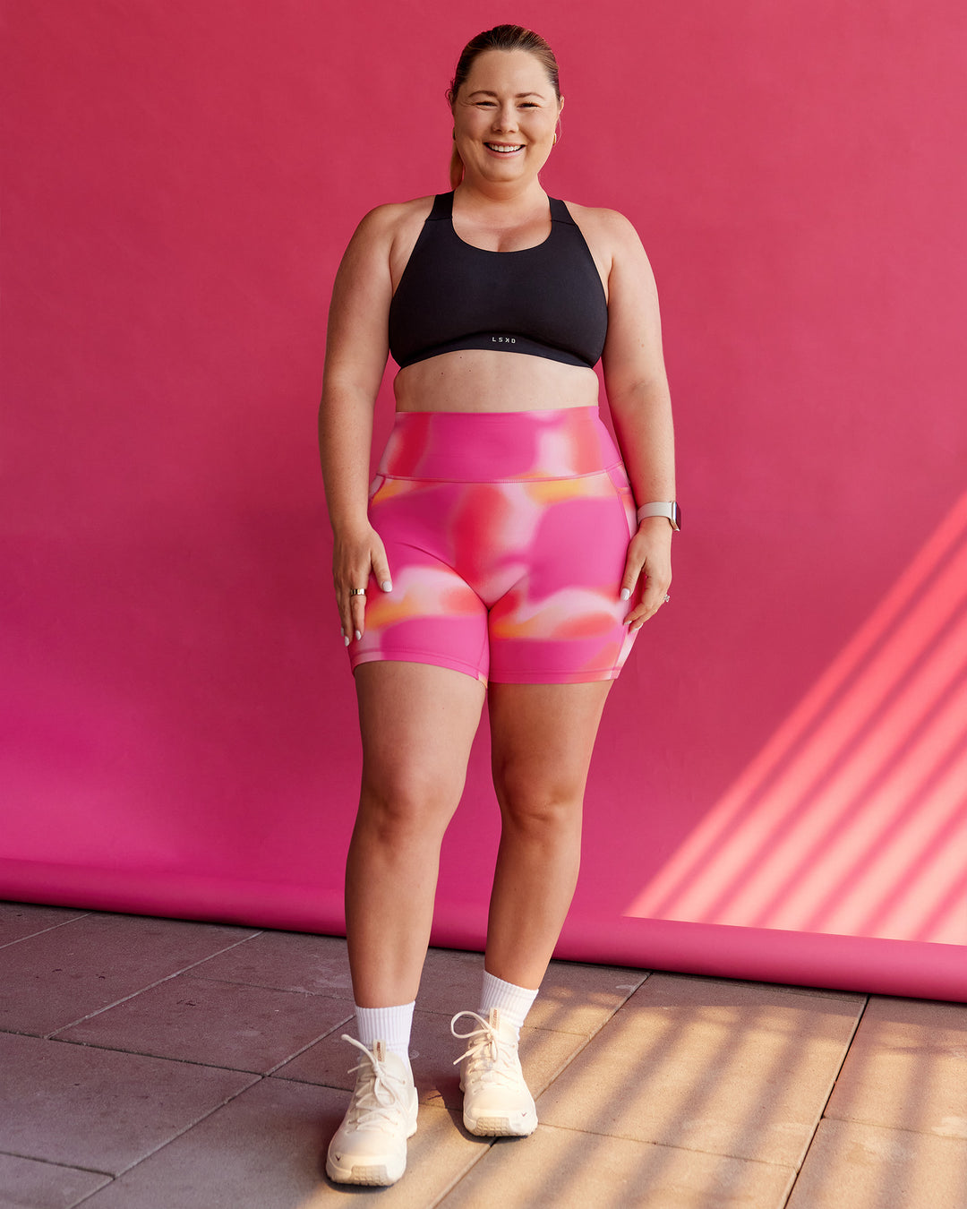 Woman wearing Fusion Ultra High-Rise 6&quot; Short Pockets - Pink Glow Print | Size:L