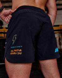 Man wearing Lift 6" Short - Black-Blue Atoll | Model:Hiko | Size:L