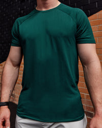 Man wearing AeroFLX+ Seamless Tee - Dark Moss/Dark Moss | Size:L