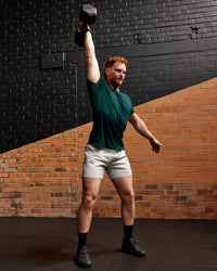 Man wearing AeroFLX+ Seamless Tee - Dark Moss/Dark Moss | Size:L