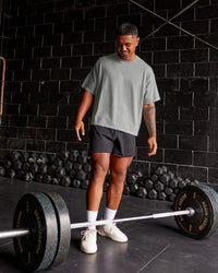 Man wearing Oversized Heavyweight Boxed Tee - Light Grey Marl | Model:Xav | Size:L