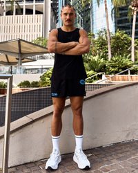 Man wearing Pace 5" Lined Running Short - Black-Palace Blue | Model:Cooper | Size:L