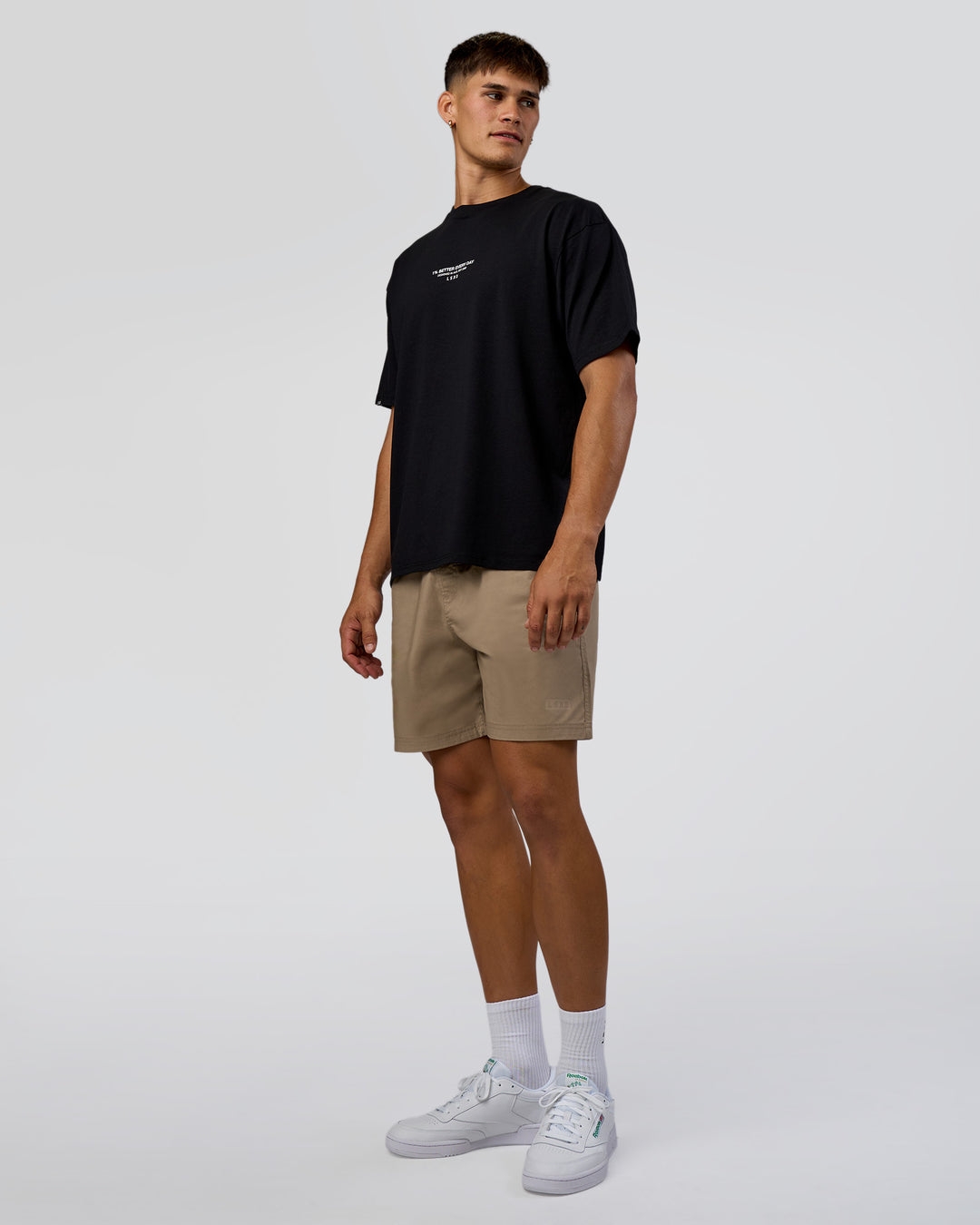 Man wearing 1% Better Every Day EST FLXCotton Oversized Tee - Black | Model:Jackson | Size:L