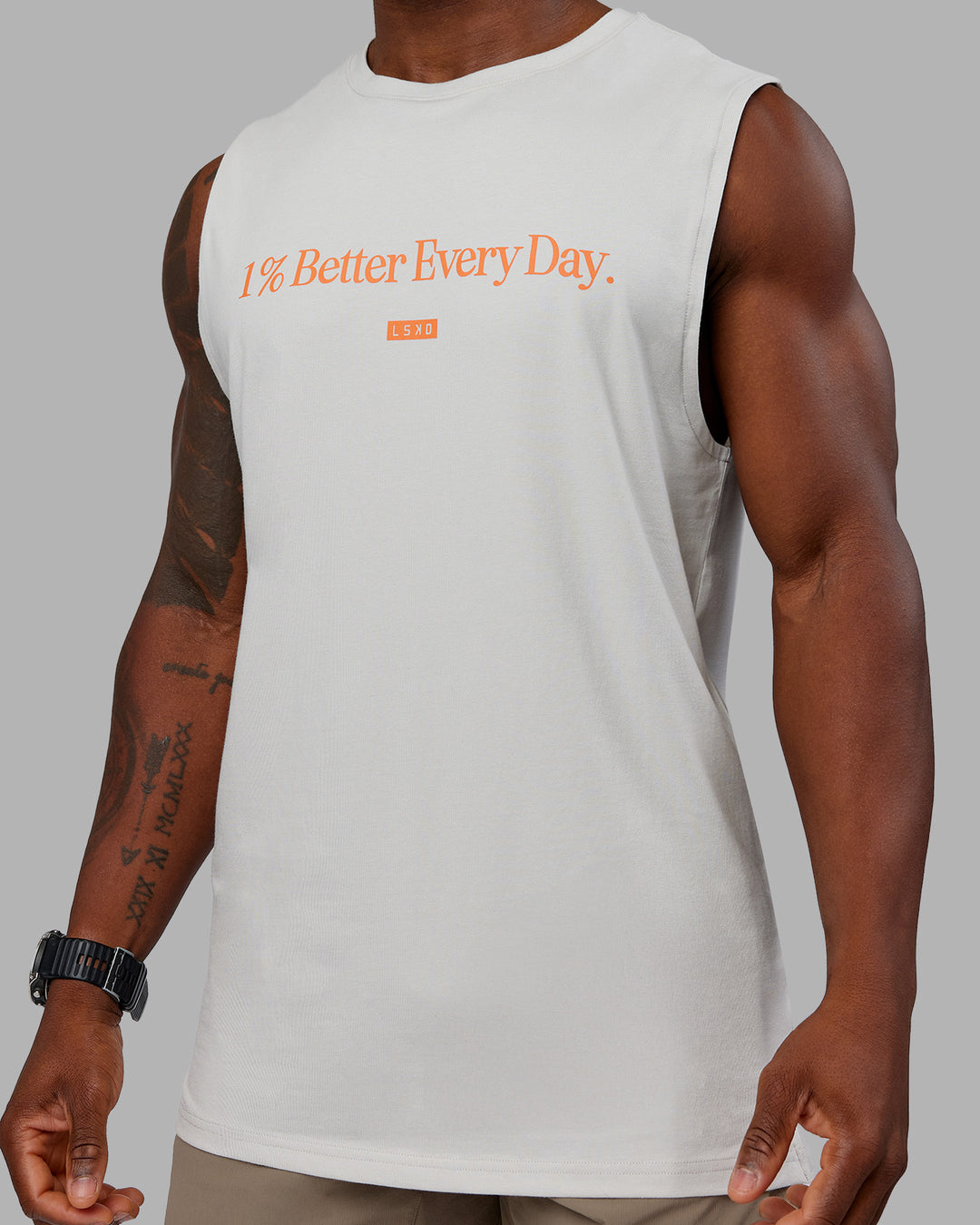 Man wearing 1% Better FLXCotton Training Fit Tank - Digital Mist-Ultra Orange | Model:Sam | Size:L