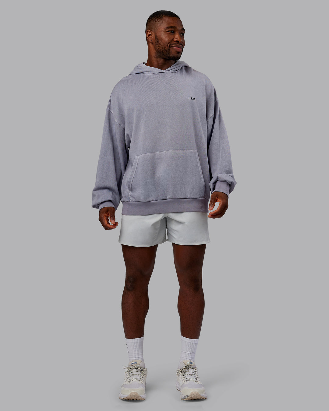 Man wearing 1% Better Value Series Oversized Hoodie - Violet Ray-Black | Model:Sam | Size:L
