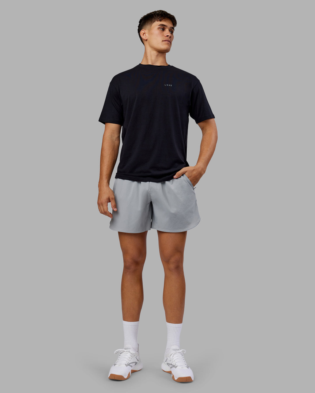 Man wearing 1% Better Value Series FLXCotton Tee Oversize - Black-Black | Model:Jackson | Size:L