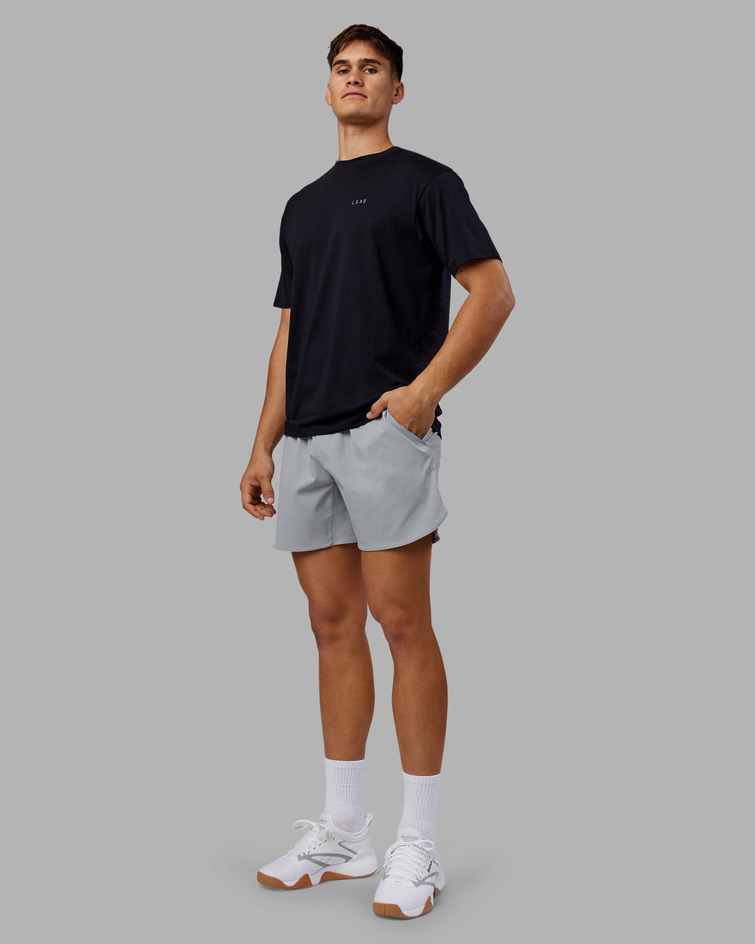 Man wearing 1% Better Value Series FLXCotton Tee Oversize - Black-Black | Model:Jackson | Size:L